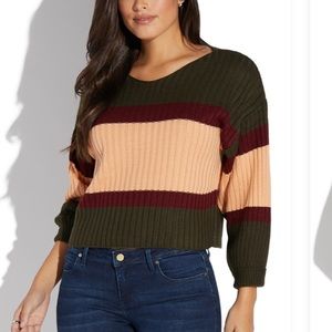 Slightly cropped sweater. STILL IN PCKAGE.